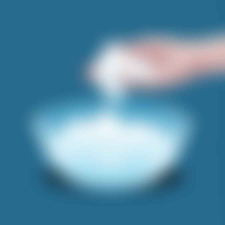 Dry ice being added into the smaller bowl