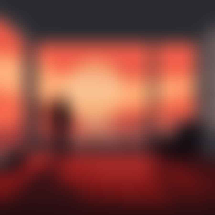 A room filled with fog, with a photographer taking pictures.