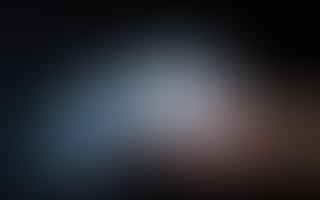 What causes dry ice to feel sticky? Isn't it just frozen water?